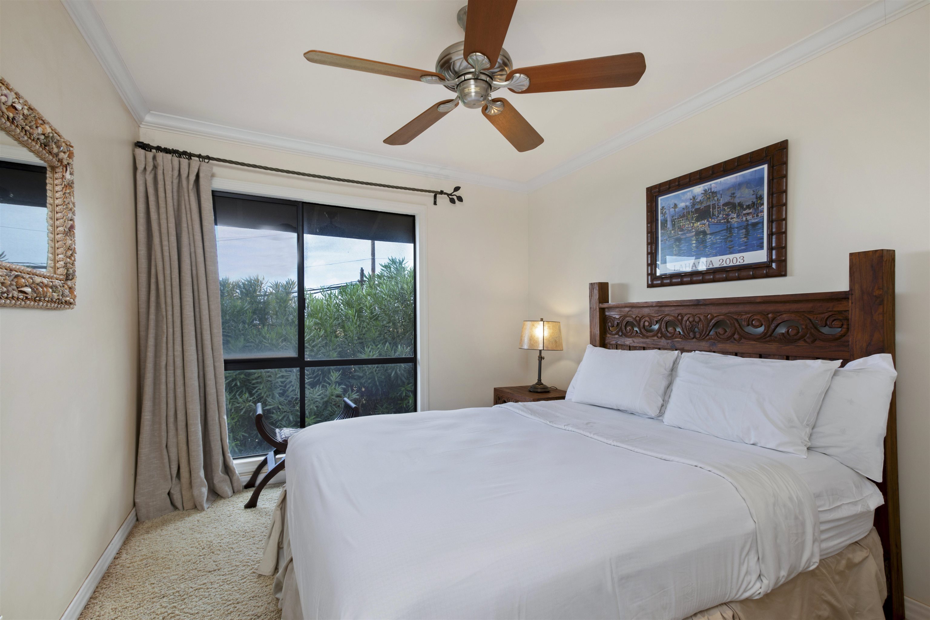 150 Puukolii Road, Unit 41 Lahaina, HI 96761 - Photo 19 of 34 a bedroom with a large bed and a window