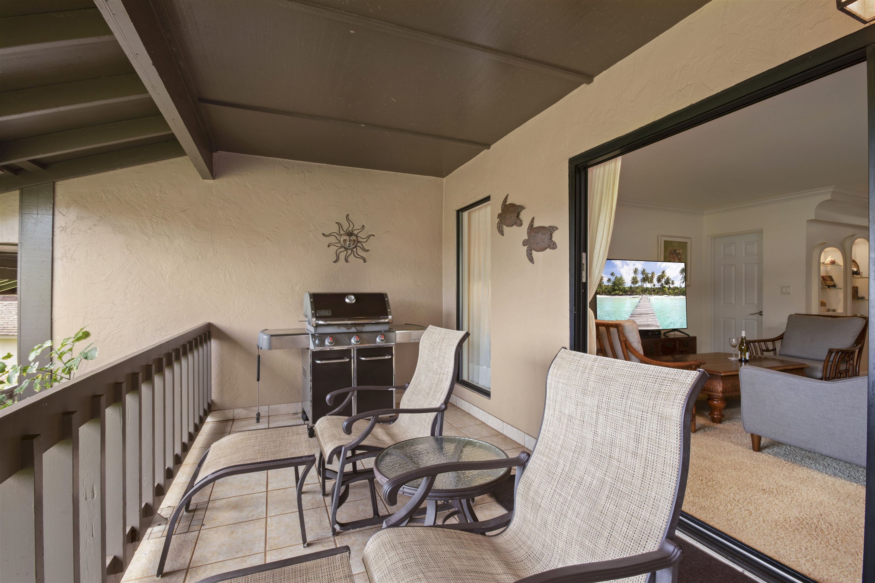 150 Puukolii Road, Unit 41 Lahaina, HI 96761 - Photo 22 of 34 a living room with furniture a rug and white walls