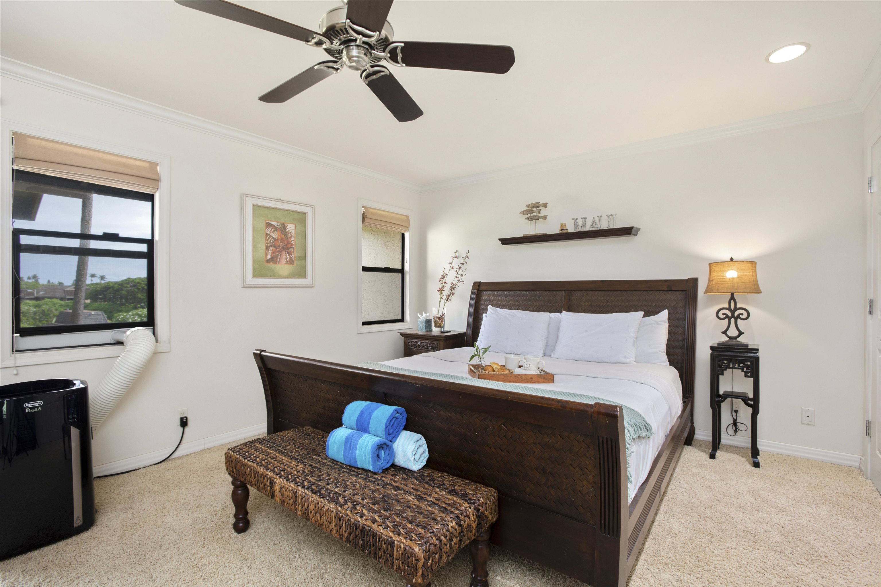 150 Puukolii Road, Unit 41 Lahaina, HI 96761 - Photo 31 of 34 a bedroom with a bed and a window