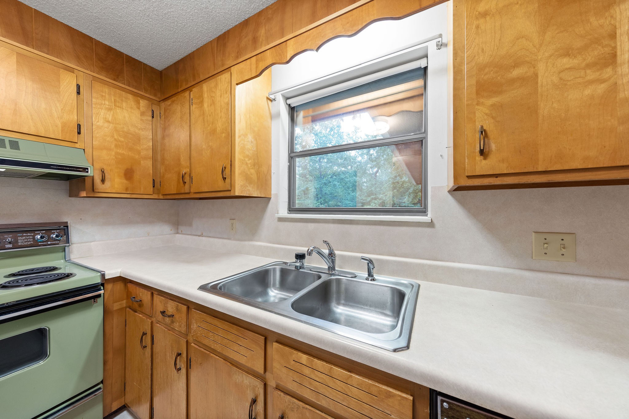 3008 Seminole Loop Crossville, TN 38572 - Photo 11 of 29 a kitchen with stainless steel appliances granite countertop a sink a stove and a microwave