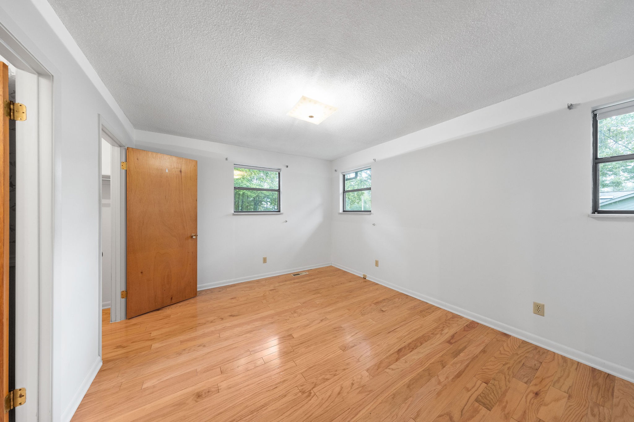 3008 Seminole Loop Crossville, TN 38572 - Photo 15 of 29 a view of empty room with wooden floor and fan