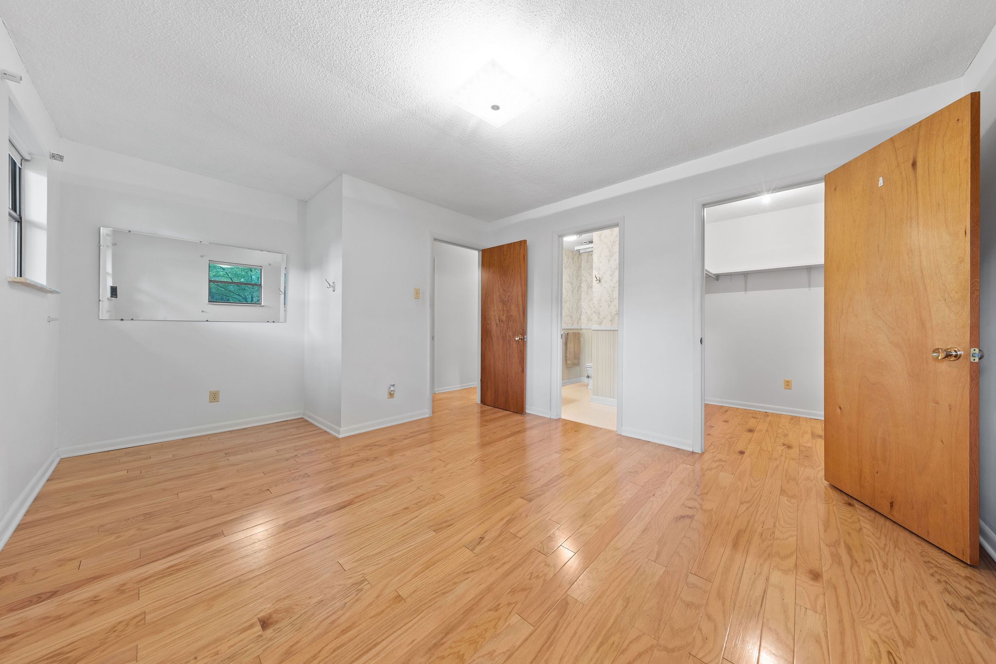 3008 Seminole Loop Crossville, TN 38572 - Photo 16 of 29 a view of an empty room with wooden floor and a window