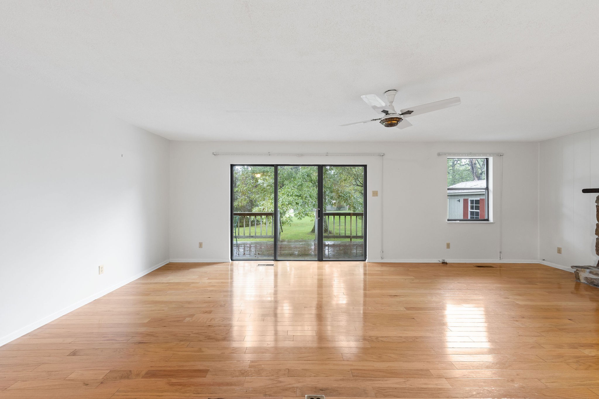 3008 Seminole Loop Crossville, TN 38572 - Photo 7 of 29 an empty room with wooden floor and windows