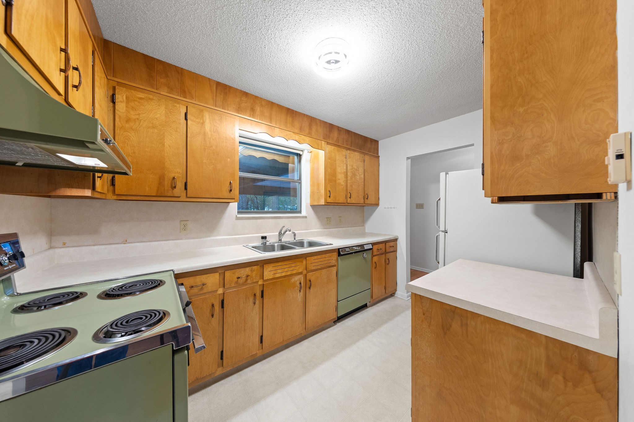 3008 Seminole Loop Crossville, TN 38572 - Photo 9 of 29 a kitchen with a sink a stove and cabinets