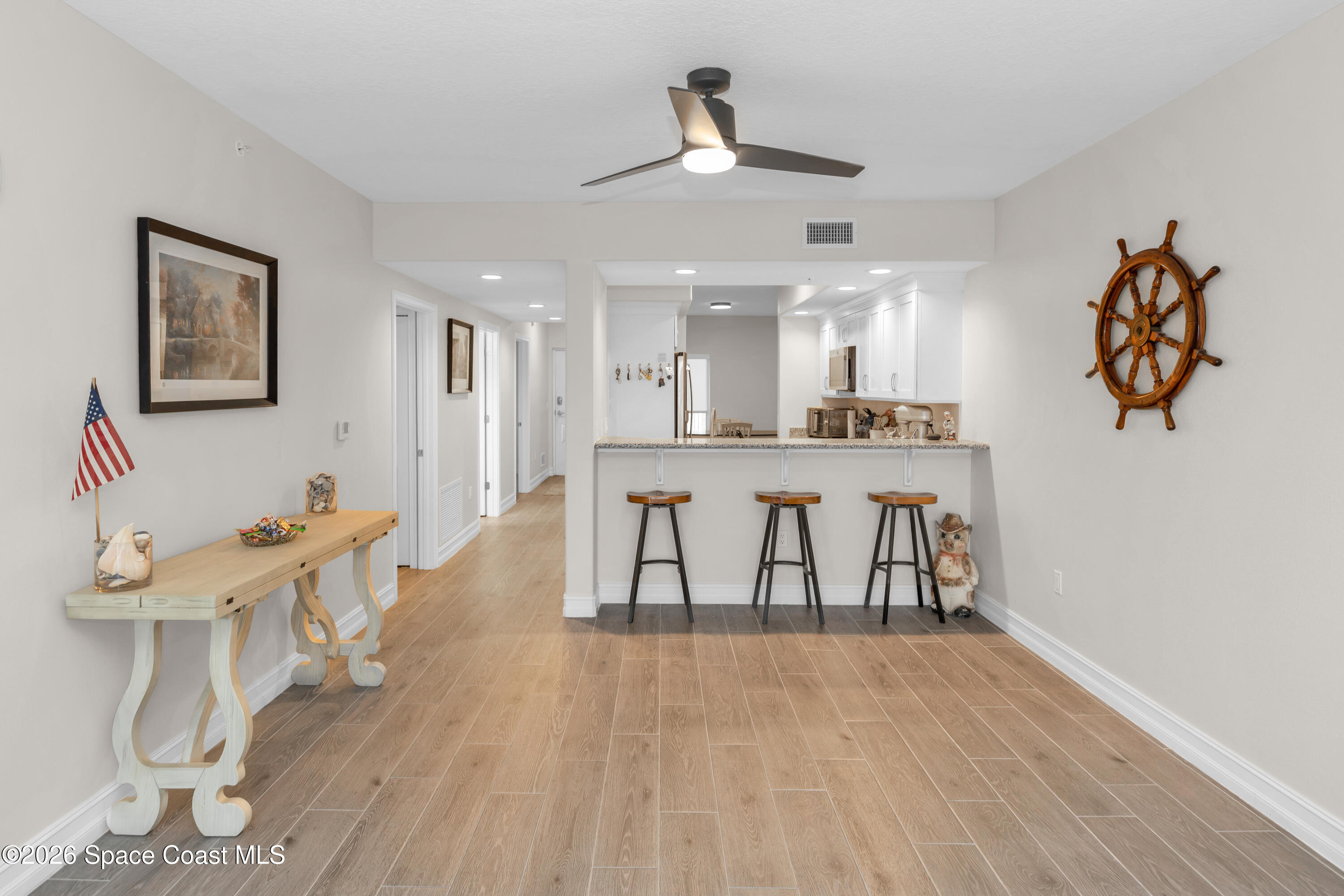 1805 Riverside Drive, Unit 506 Titusville, FL 32780 - Photo 6 of 24 a view of a kitchen and dining room