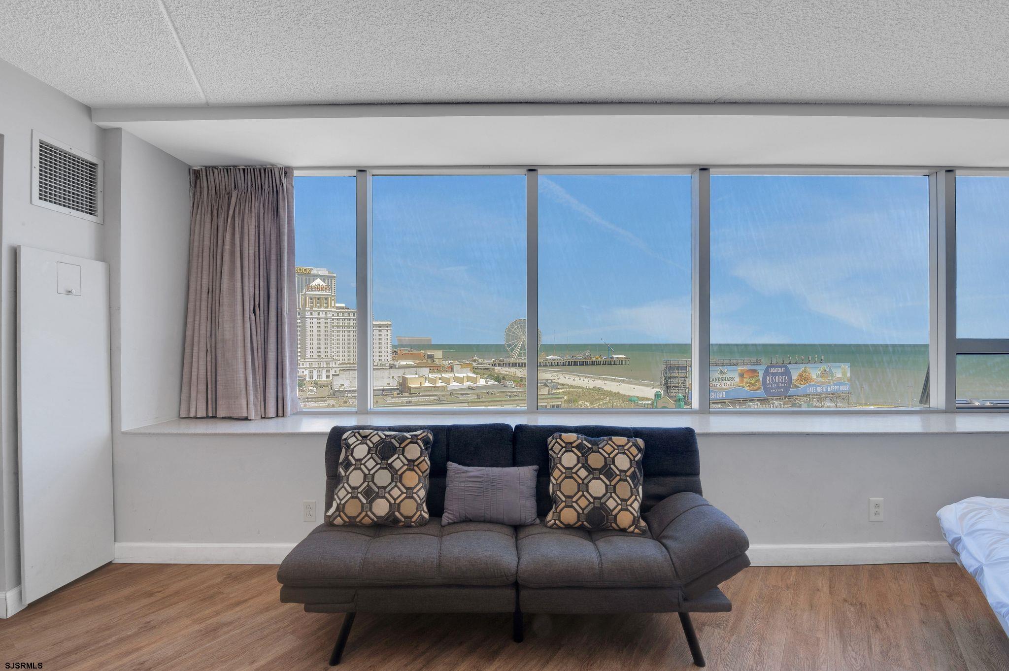 1515 Boardwalk, Unit 1004 Atlantic City, NJ 08401 - Photo 11 of 19 a living room with furniture and a large window