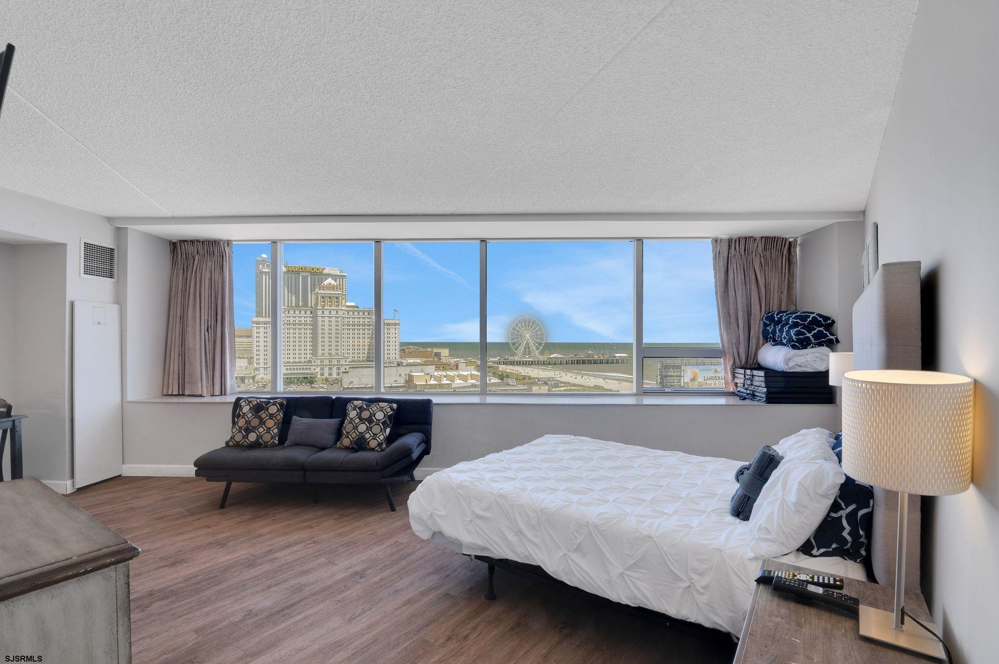 1515 Boardwalk, Unit 1004 Atlantic City, NJ 08401 - Photo 13 of 19 a living room with furniture and a large window