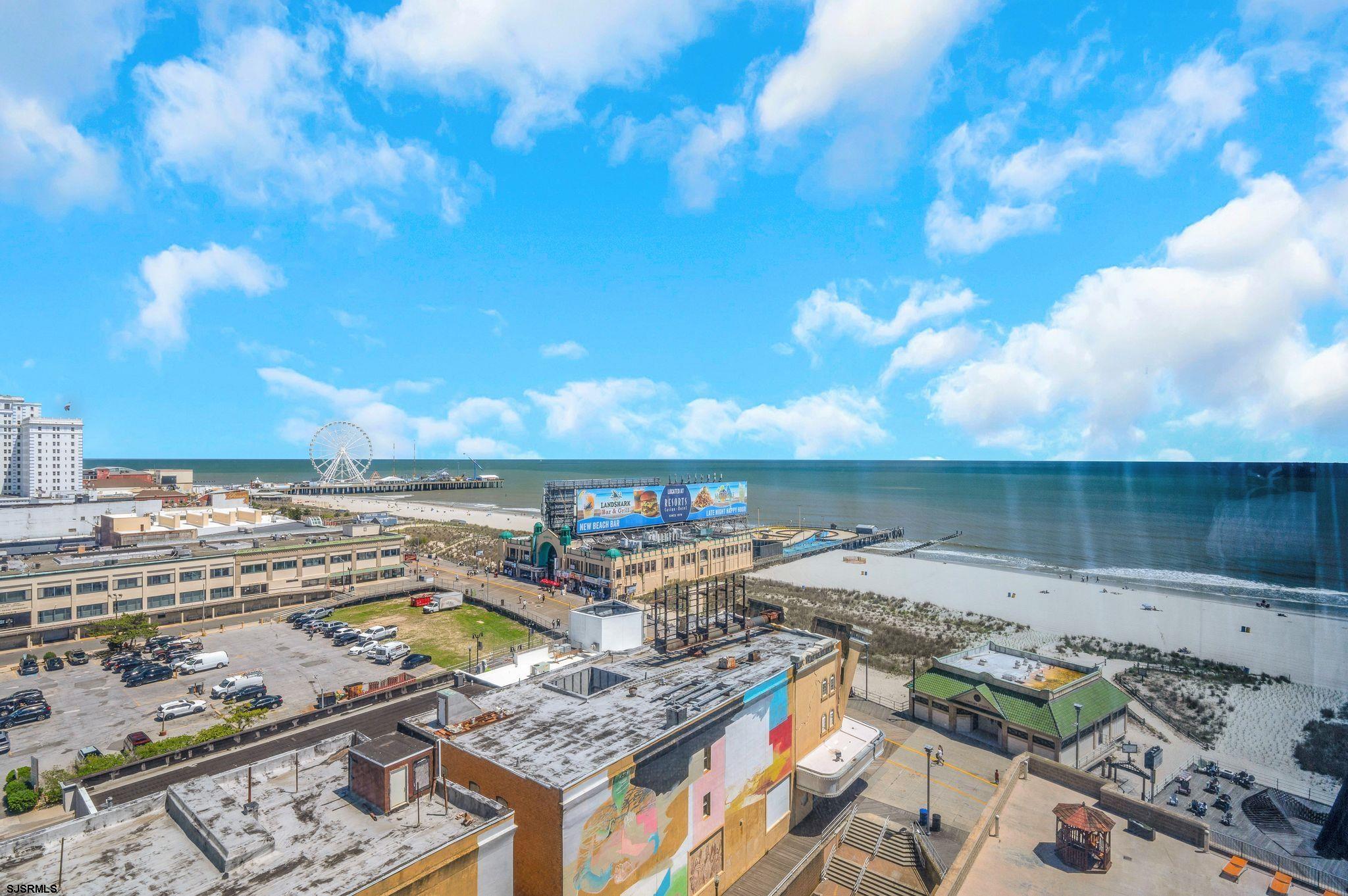 1515 Boardwalk, Unit 1004 Atlantic City, NJ 08401 - Photo 8 of 19 a view of a terrace with lawn chairs