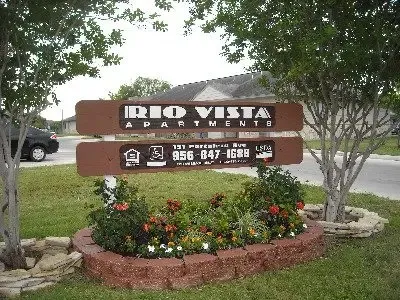 a view of a sign board with yard
