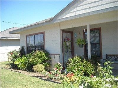 191 Portaleza Avenue Roma, TX 78584 - Photo 2 of 6 front view of a house with potted plants