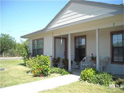 191 Portaleza Avenue Roma, TX 78584 - Photo 3 of 6 a front view of a house with garden