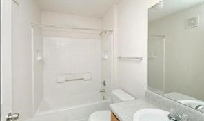 191 Portaleza Avenue Roma, TX 78584 - Photo 5 of 6 a bathroom with a toilet and shower