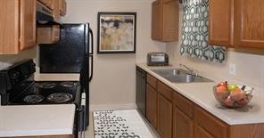 191 Portaleza Avenue Roma, TX 78584 - Photo 6 of 6 a kitchen with stainless steel appliances granite countertop a sink stove and refrigerator