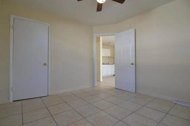 an empty room that has a window in it