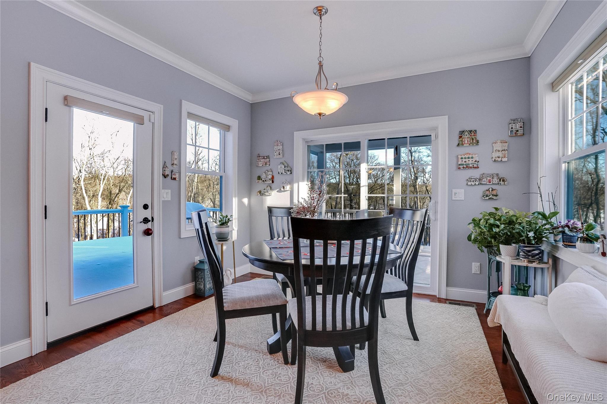 23 Swan Holw Road New Windsor, NY 12553 - Photo 12 of 28 The sun-filled eat-in kitchen features expansive windows that flood the space with natural light while offering beautiful views of the reservoir.