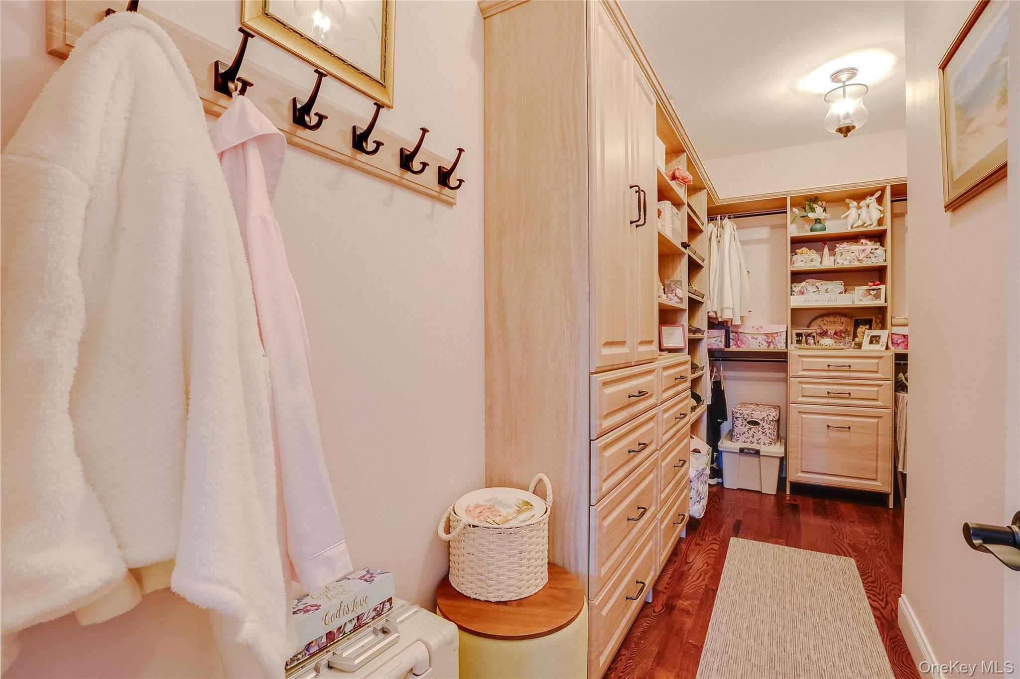 23 Swan Holw Road New Windsor, NY 12553 - Photo 16 of 28 A one-of-a-kind custom walk-in closet in the primary bedroom features built-in drawers and shelving for optimal organization.