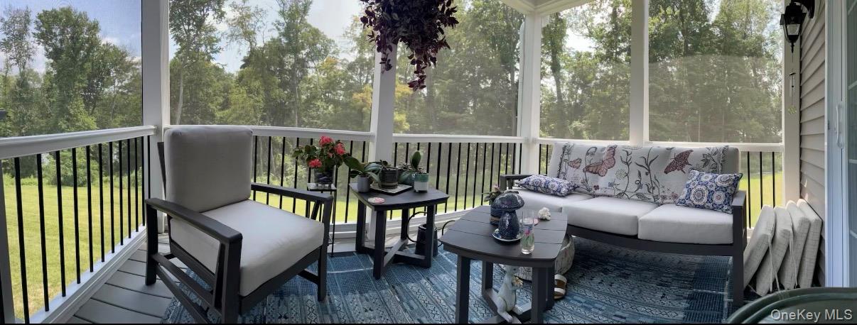 23 Swan Holw Road New Windsor, NY 12553 - Photo 22 of 28 Relax on the stunning screened-in porch while enjoying tranquil reservoir views—perfect for morning coffee or evening gatherings.