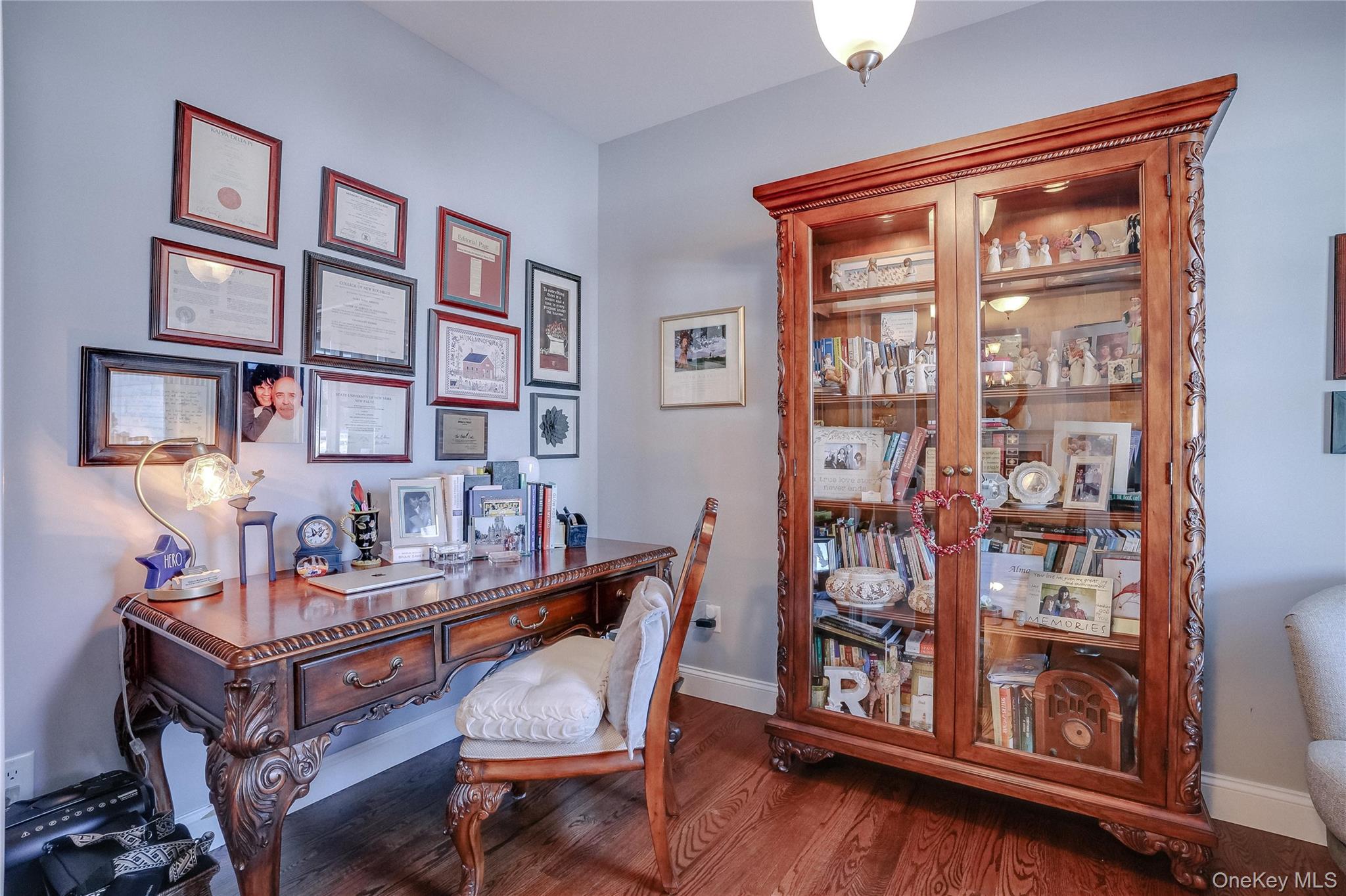 23 Swan Holw Road New Windsor, NY 12553 - Photo 8 of 28 Just off the entry, a beautifully appointed home office showcases rich hardwood floors and classic pocket doors, creating a refined and private space ideal for work or study.