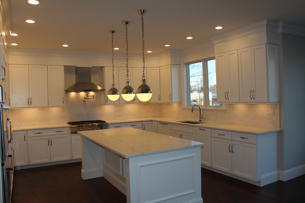 72 Canterbury Road Newton, MA 02464 - Photo 7 of 11 a kitchen with a sink a center island a stove and a window