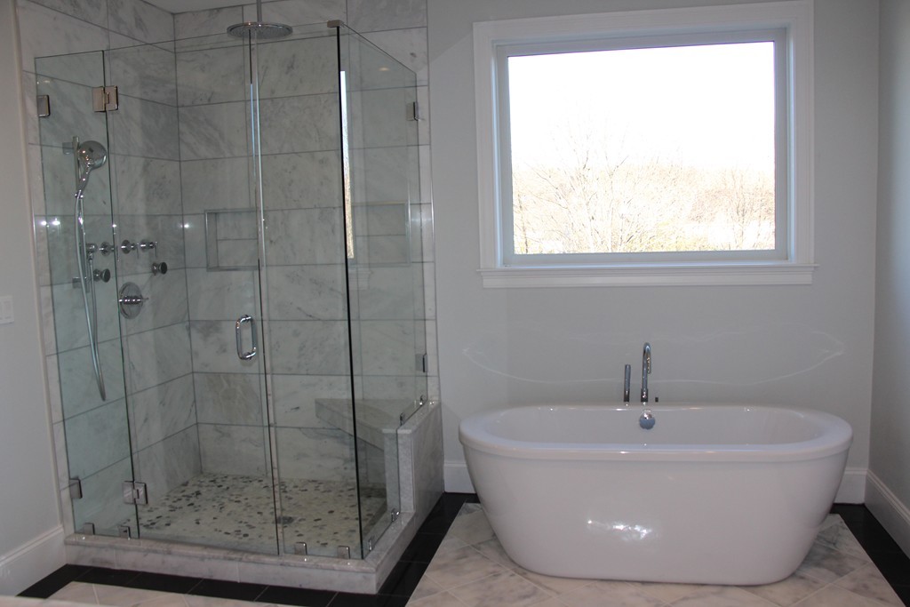 72 Canterbury Road Newton, MA 02464 - Photo 8 of 11 a white bath tub sitting next to a window