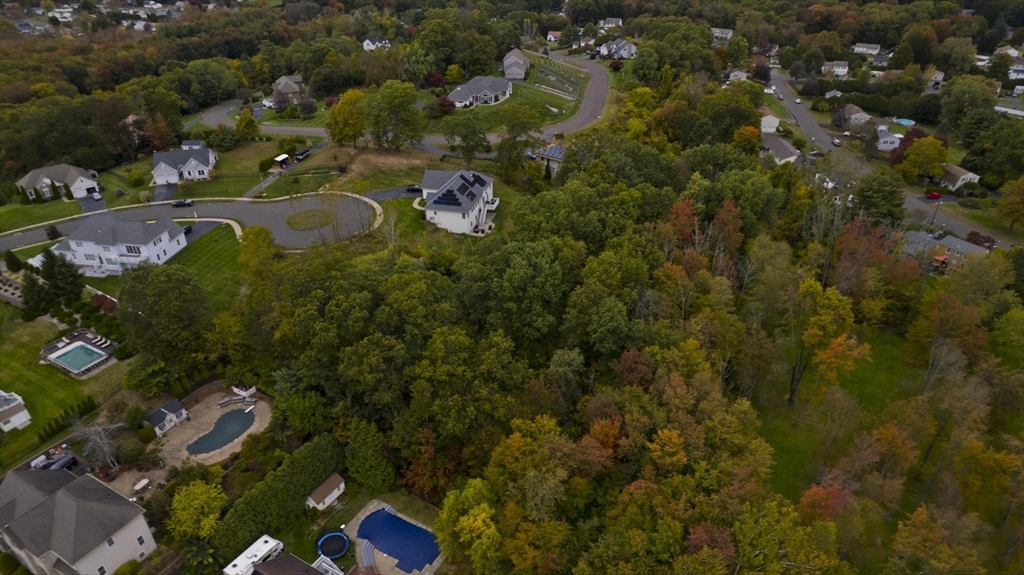 200 Anvil Street Feeding Hills, MA 01030 - Photo 4 of 12 an aerial view of residential house with outdoor space and trees all around