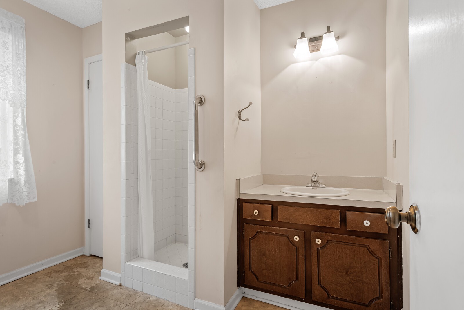 3352 Country Way Road Antioch, TN 37013 - Photo 14 of 26 a bathroom with a granite countertop sink a mirror and shower