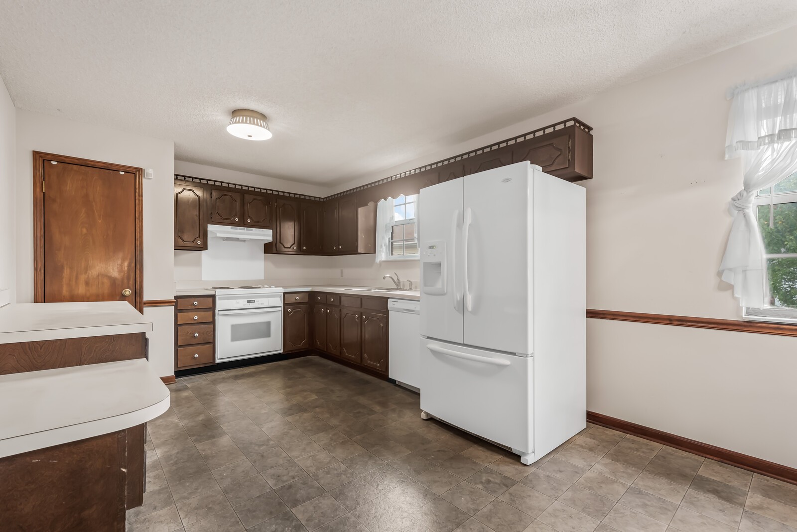3352 Country Way Road Antioch, TN 37013 - Photo 5 of 26 a kitchen with stainless steel appliances a refrigerator sink and white cabinets