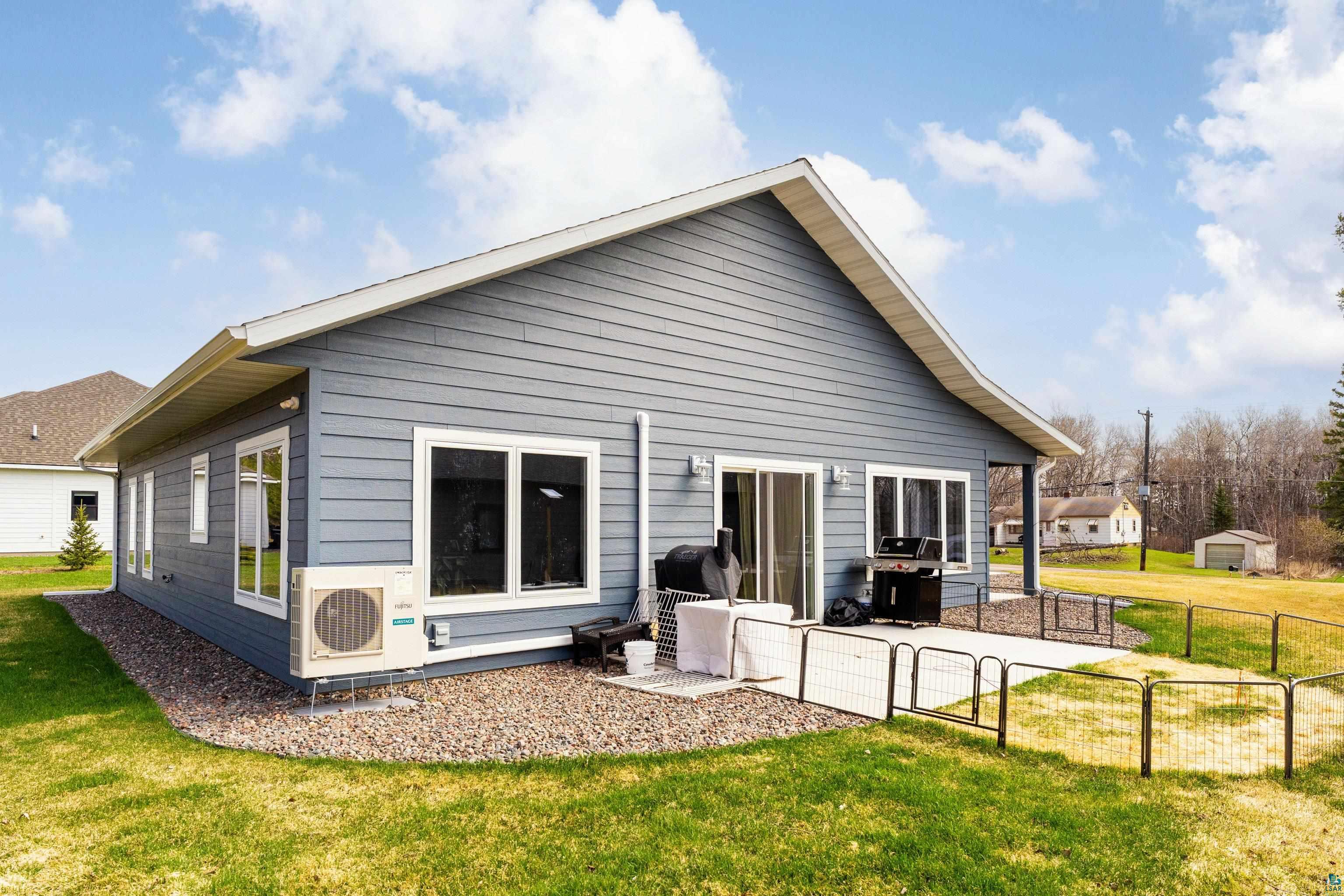 3829 Stebner Road Hermantown, MN 55811 - Photo 28 of 28 Rear exterior featuring gray horizontal siding and a white trim