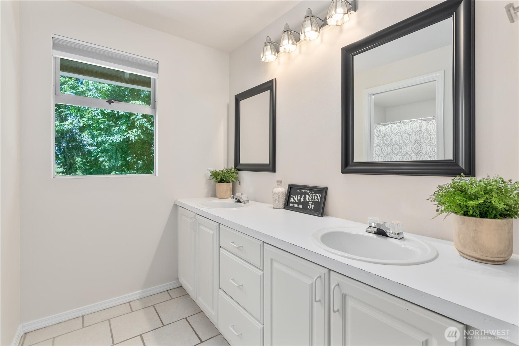 2101 233rd Street Southeast Bothell, WA 98021 - Photo 17 of 40 a bathroom with a sink and a mirror