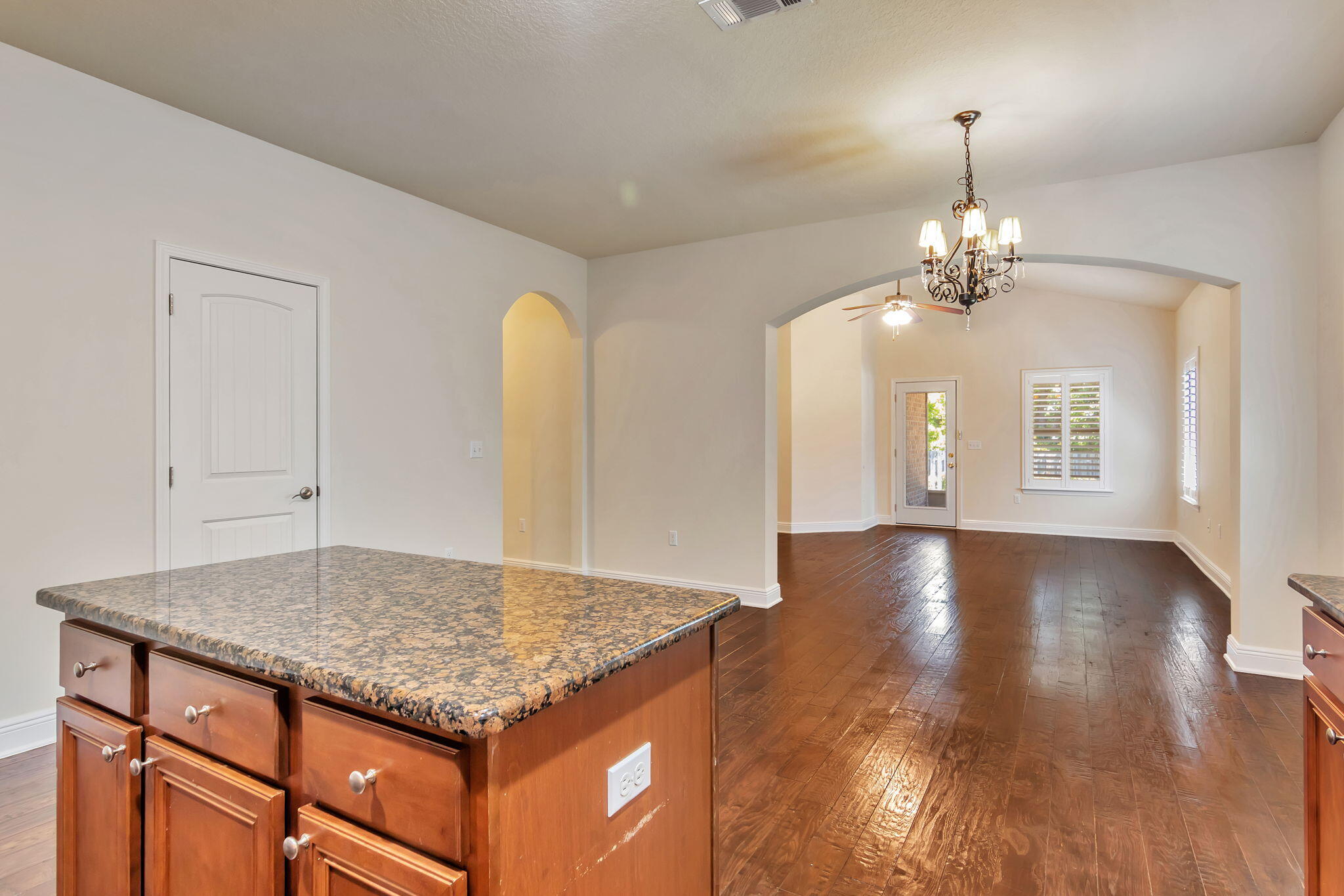 256 Cocobolo Drive Santa Rosa Beach, FL 32459 - Photo 13 of 45 a view of kitchen and hall with wooden floor