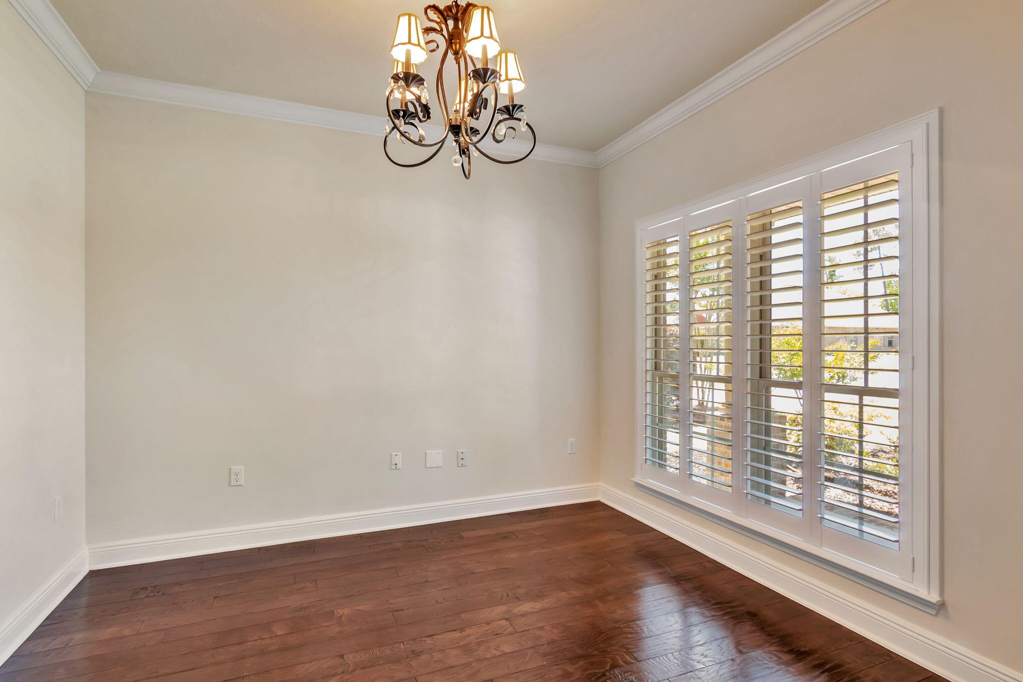 256 Cocobolo Drive Santa Rosa Beach, FL 32459 - Photo 18 of 45 a view of empty room with wooden floor and fan