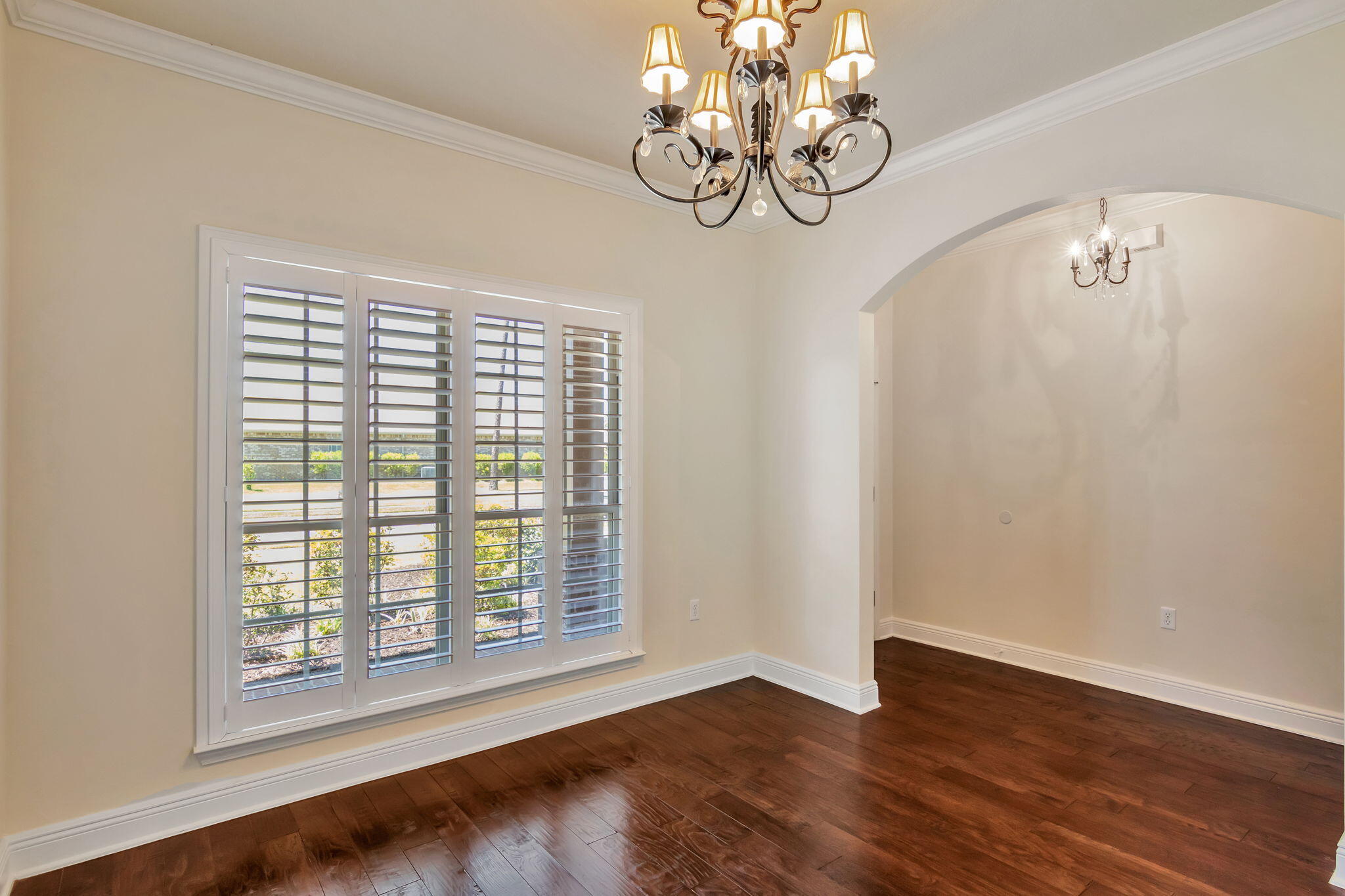 256 Cocobolo Drive Santa Rosa Beach, FL 32459 - Photo 19 of 45 a view of an empty room with wooden floor and a window