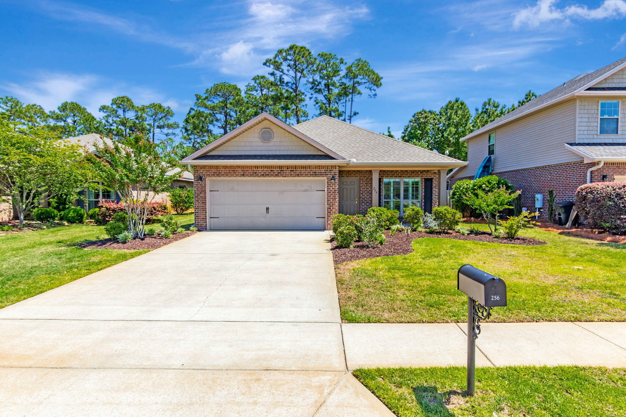 256 Cocobolo Drive Santa Rosa Beach, FL 32459 - Photo 2 of 45 a front view of a house with garden