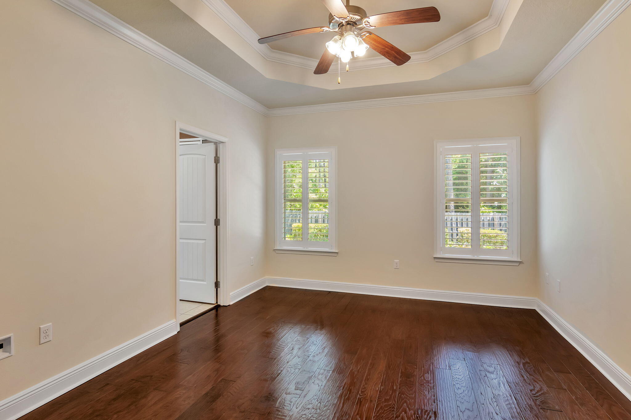 256 Cocobolo Drive Santa Rosa Beach, FL 32459 - Photo 21 of 45 a view of an empty room with wooden floor and a window