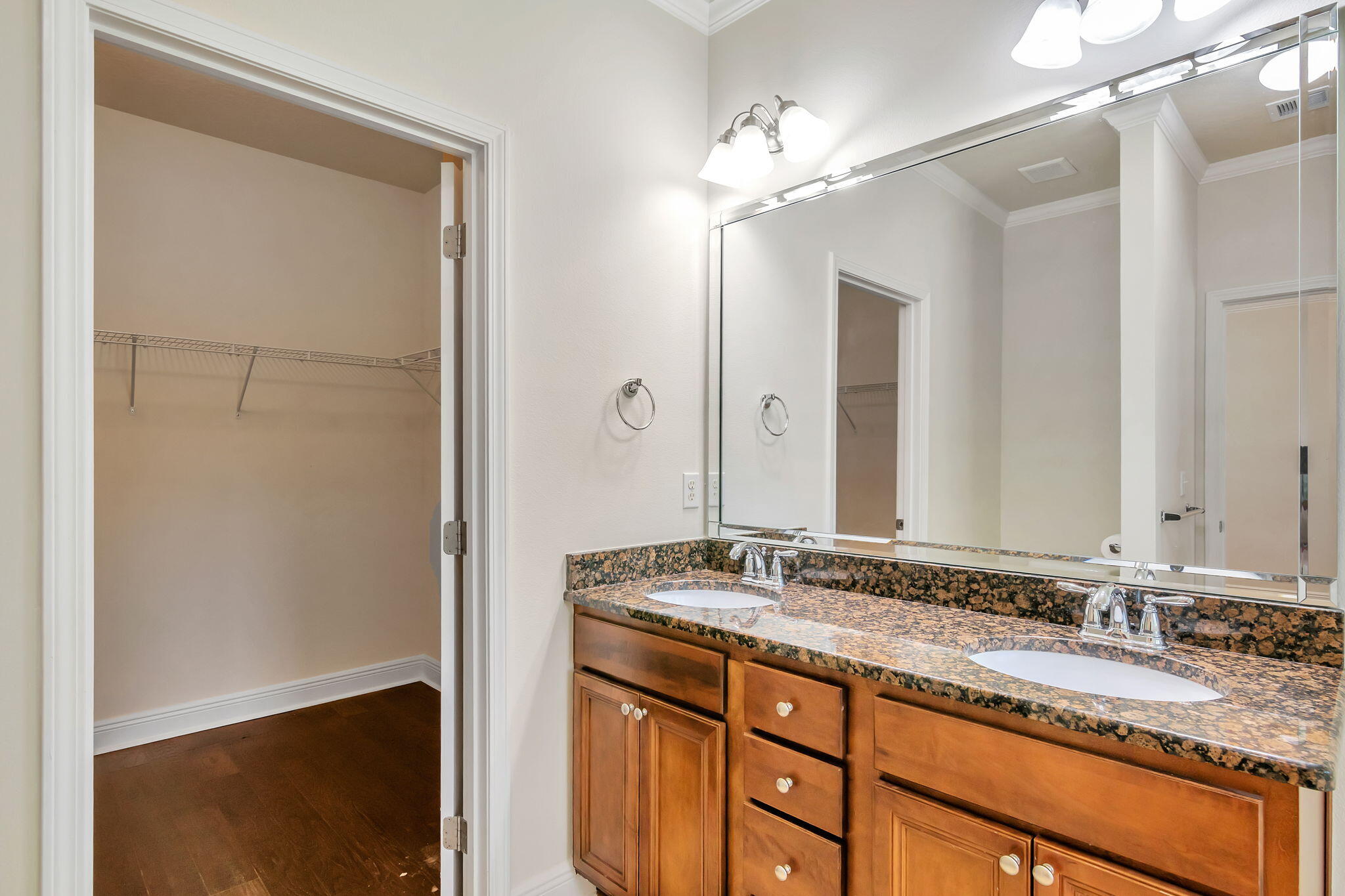 256 Cocobolo Drive Santa Rosa Beach, FL 32459 - Photo 28 of 45 a bathroom with a granite countertop sink and a mirror