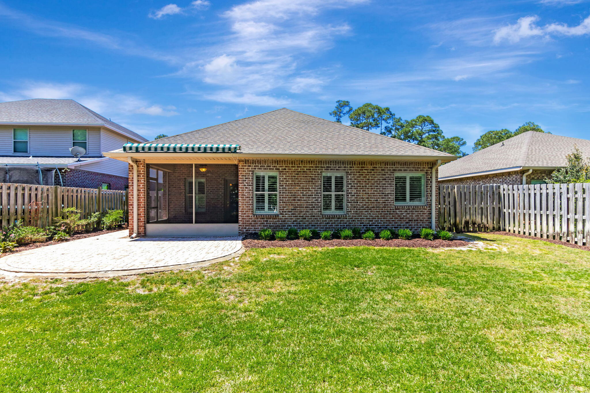 256 Cocobolo Drive Santa Rosa Beach, FL 32459 - Photo 36 of 45 a front view of a house with a garden