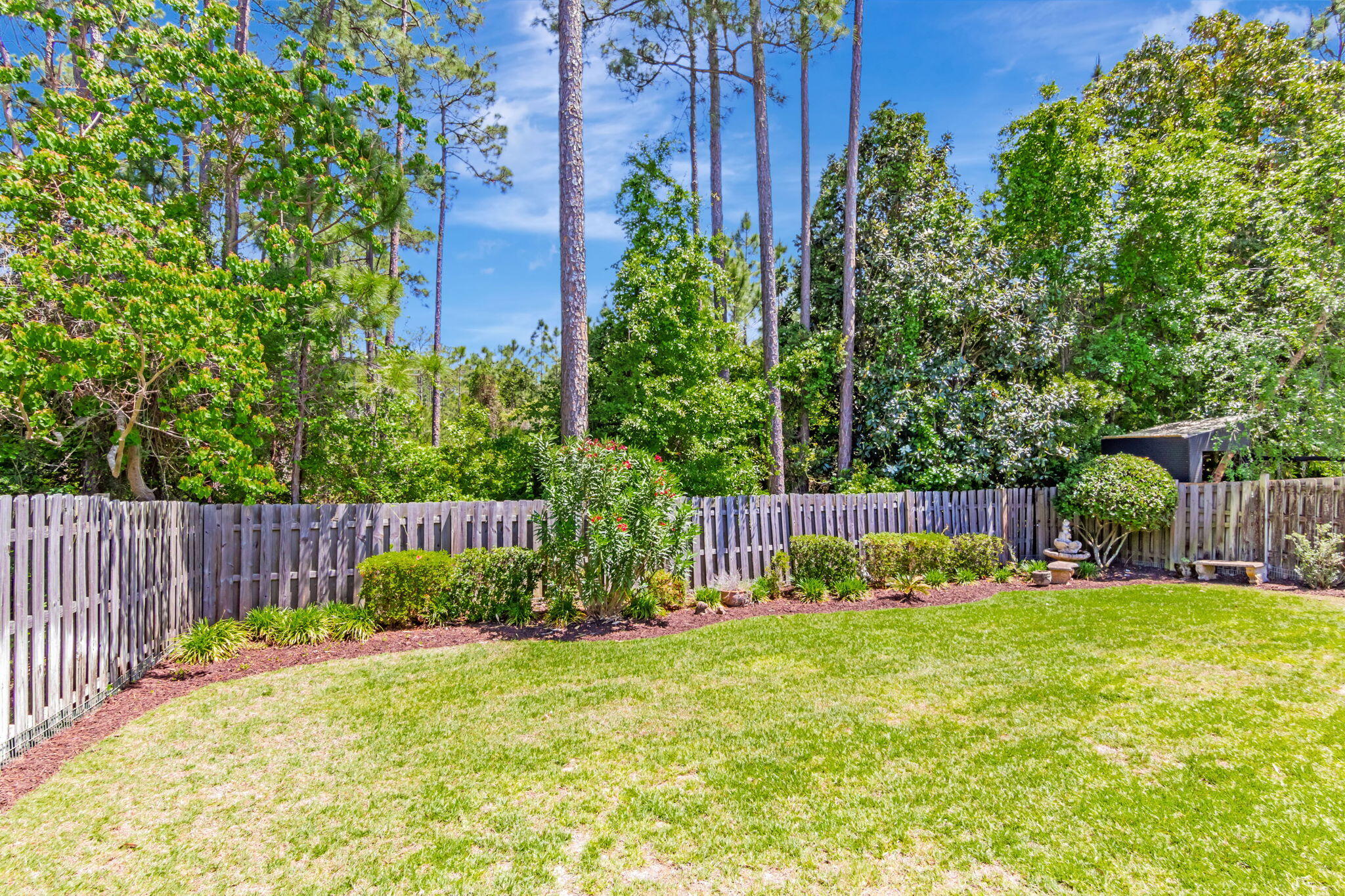 256 Cocobolo Drive Santa Rosa Beach, FL 32459 - Photo 40 of 45 a view of a backyard with a garden