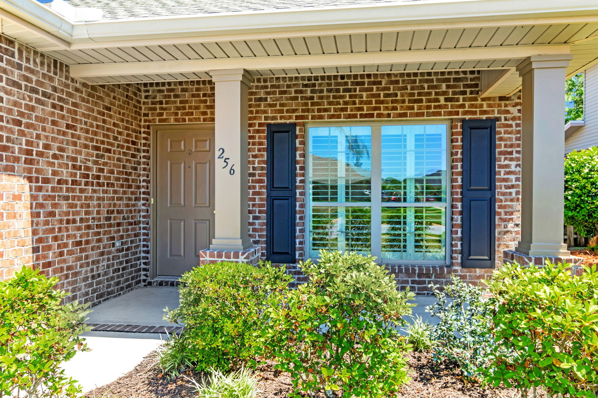 256 Cocobolo Drive Santa Rosa Beach, FL 32459 - Photo 5 of 45 a front view of a house with a garden