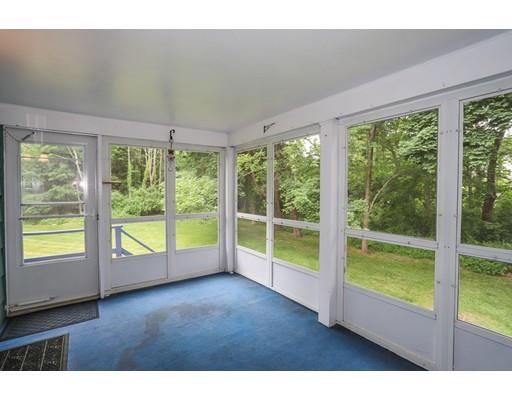 18 Ballardvale Road Andover, MA 01810 - Photo 11 of 28 a view of an empty room with wooden floor and windows