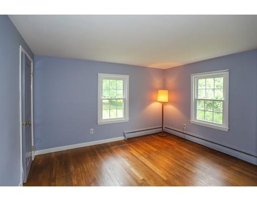 18 Ballardvale Road Andover, MA 01810 - Photo 17 of 28 an empty room with wooden floor and windows