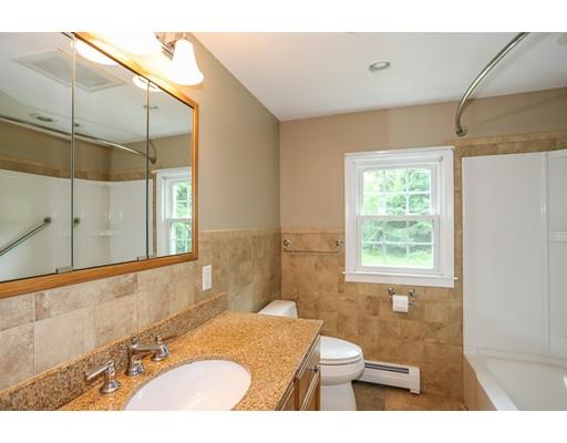 18 Ballardvale Road Andover, MA 01810 - Photo 9 of 28 a bathroom with a granite countertop sink mirror vanity and toilet