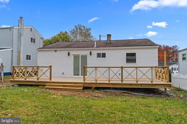 a view of a house with a yard from a balcony