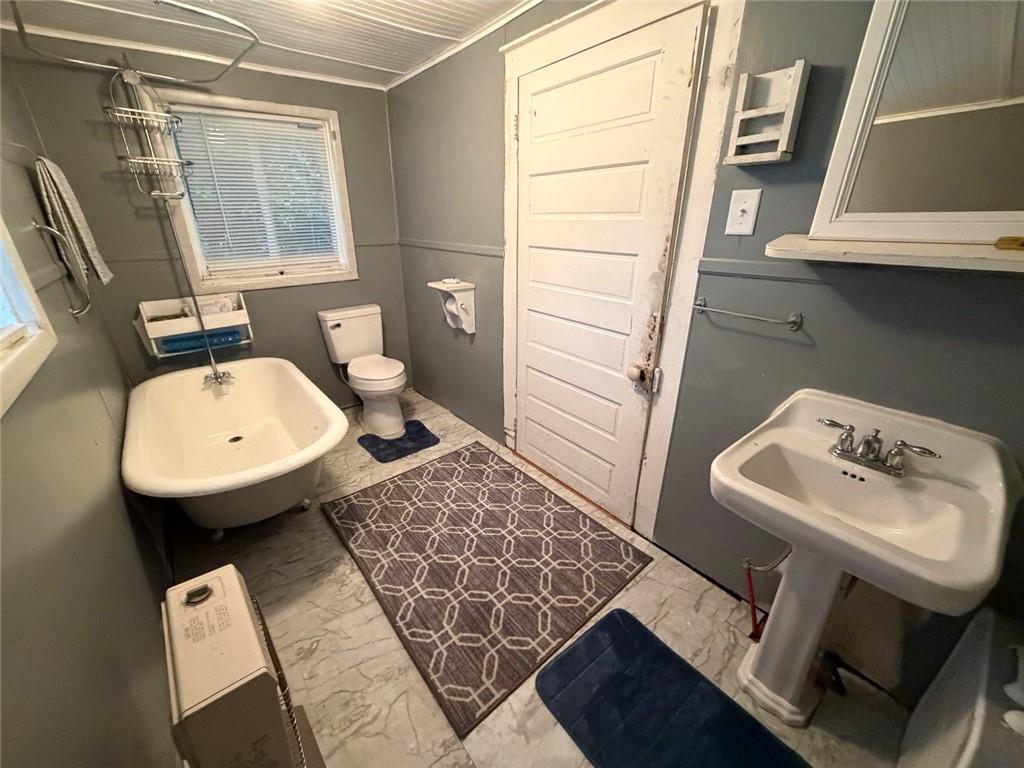 209 Old Perry Road Marshallville, GA 31057 - Photo 10 of 40 a bathroom with a sink toilet and mirror