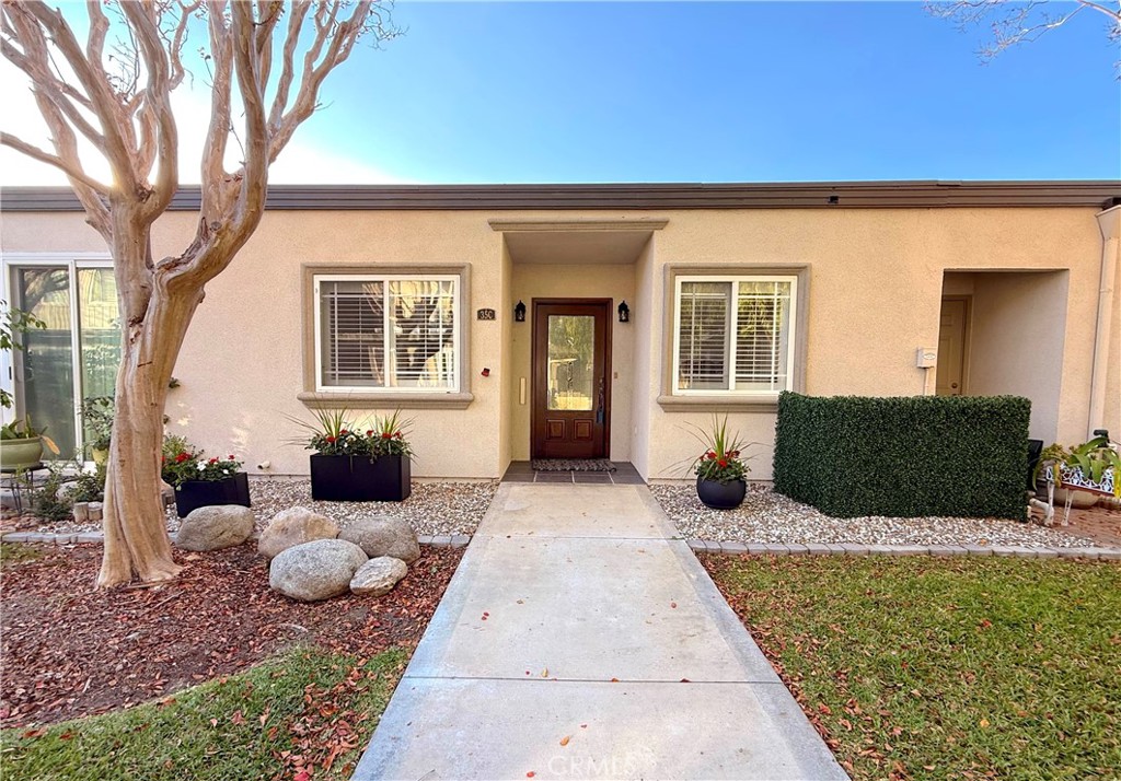1921 St John Road, Unit 35C Seal Beach, CA 90740 - Photo 1 of 40 a view of a house with a yard
