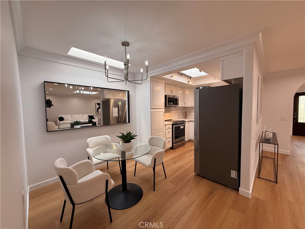 1921 St John Road, Unit 35C Seal Beach, CA 90740 - Photo 11 of 40 a living room with furniture and a wooden floor