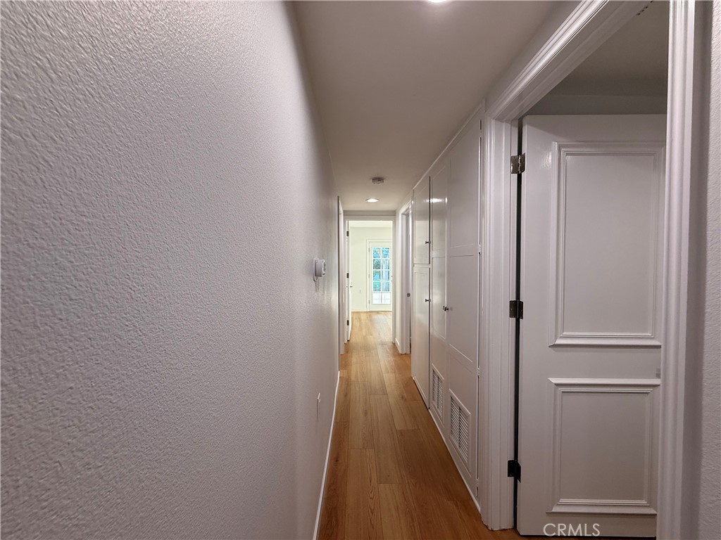 1921 St John Road, Unit 35C Seal Beach, CA 90740 - Photo 19 of 40 a view of a hallway with wooden floor