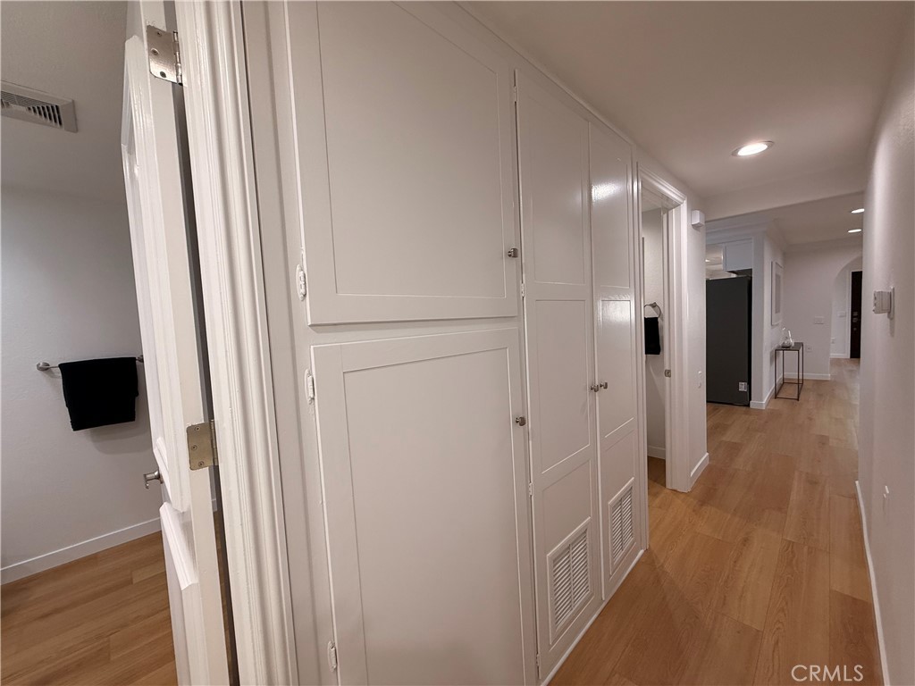 1921 St John Road, Unit 35C Seal Beach, CA 90740 - Photo 20 of 40 a view of a hallway with wooden floor