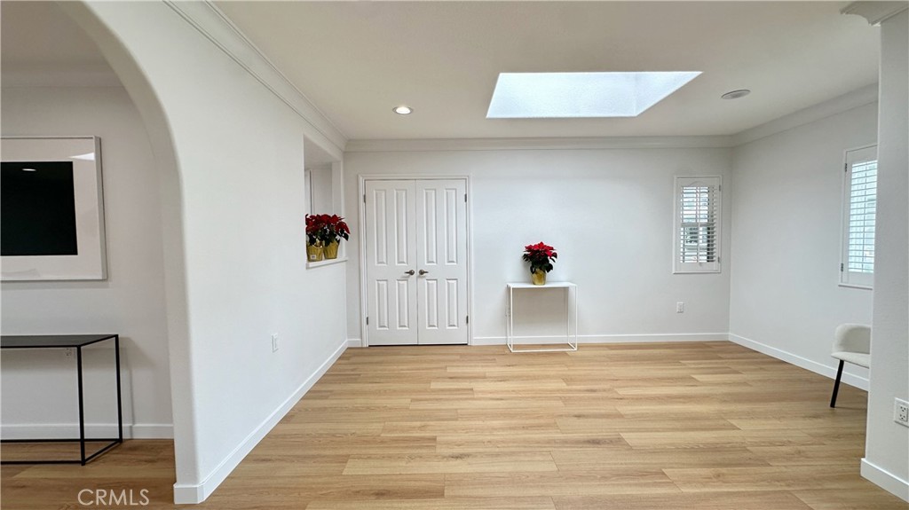 1921 St John Road, Unit 35C Seal Beach, CA 90740 - Photo 2 of 11 a view of a livingroom with wooden floor and entryway