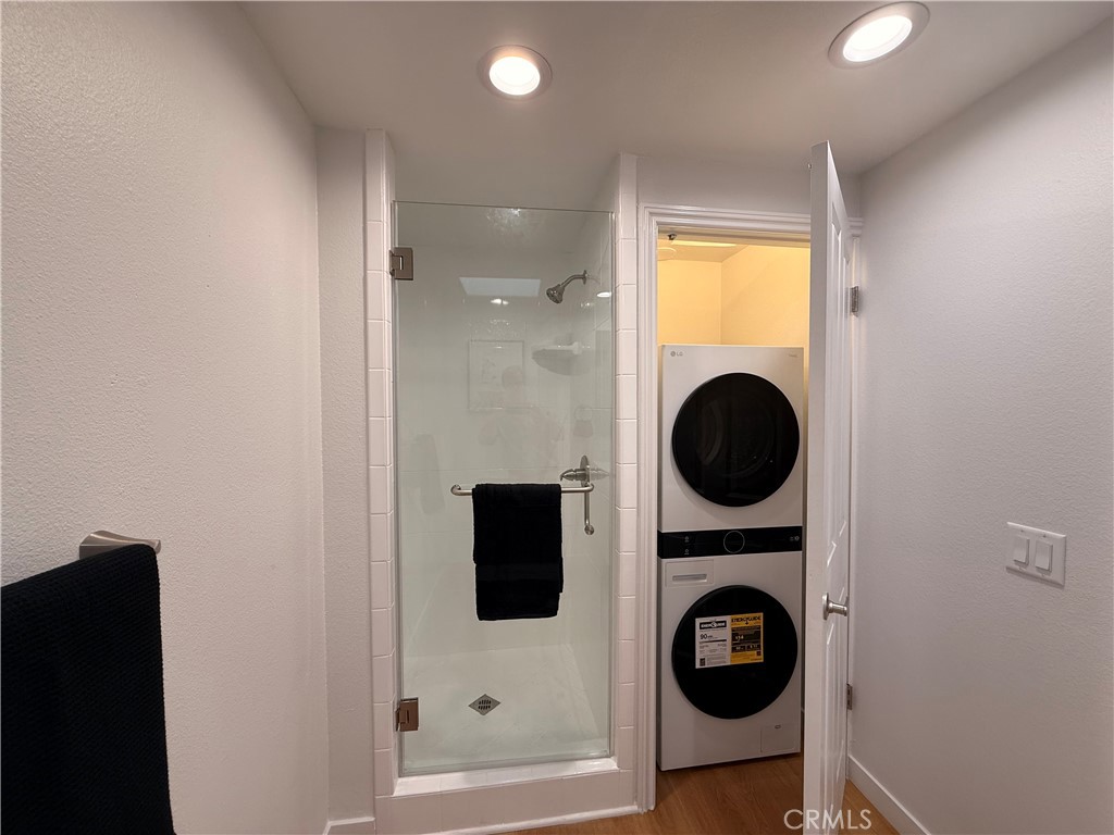 1921 St John Road, Unit 35C Seal Beach, CA 90740 - Photo 21 of 40 a view of a hallway with washer and dryer