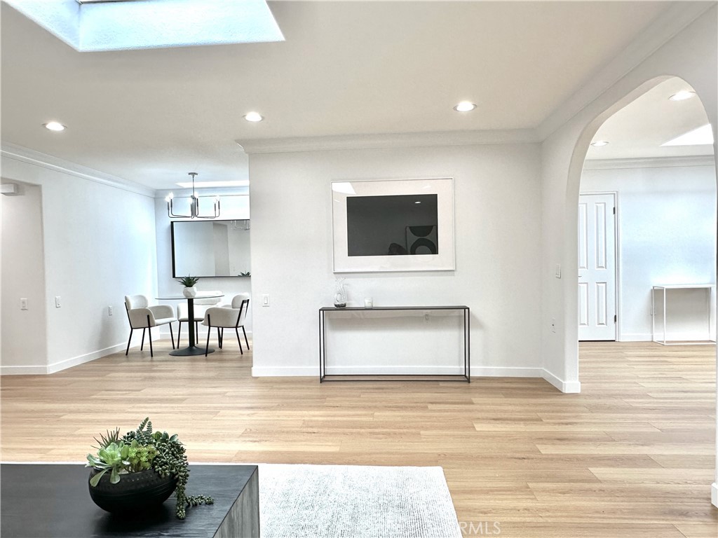 1921 St John Road, Unit 35C Seal Beach, CA 90740 - Photo 3 of 11 a living room with furniture and a flat screen tv